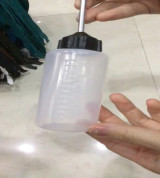 Lọ đựng dầu máy- ko có dầu, chỉ có lọ