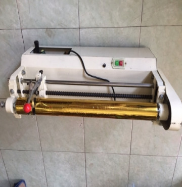 máy cắt nhủ (giấy ép kim)