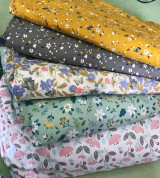 vải thô tồn kho mặt lụa hình hoa lá