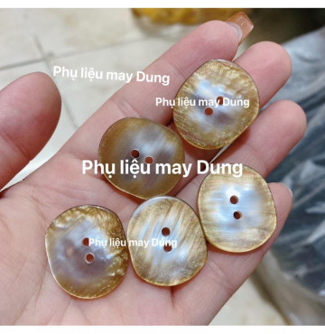 nút vest 2 lỗ cừ tồn kho